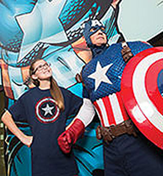 Captain America posing with student